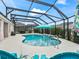 Beautiful private pool area with a water feature, lounge chairs, and lush landscaping at 4406 Creighton Loop, The Villages, FL 32163