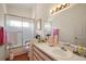 Bright bathroom with a sleek vanity, featuring a mirrored wall and a clean, functional layout at 4553 Belle Grv, Leesburg, FL 34748