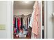 Walk-in closet showcasing ample storage with hanging rods and shelving for organized clothing and accessories at 4553 Belle Grv, Leesburg, FL 34748