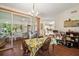 Bright dining area with sliding glass doors and a view of the lanai at 4553 Belle Grv, Leesburg, FL 34748