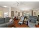 Spacious living room with a ceiling fan, wood floors, and access to the dining area at 4553 Belle Grv, Leesburg, FL 34748