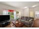 Comfortable living room with a large window and stylish furniture at 4553 Belle Grv, Leesburg, FL 34748