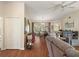 Open concept living room with dining area and sliding glass doors to the lanai at 4553 Belle Grv, Leesburg, FL 34748