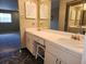 Well-lit bathroom with a double sink vanity, ample counter space, and a decorative mirror, perfect for a refreshing start at 500 Newell Hill Rd # D, Leesburg, FL 34748