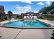 Beautiful shot of a community pool surrounded by well-maintained landscaping and buildings at 500 Newell Hill Rd # D, Leesburg, FL 34748