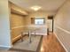 Cozy dining room featuring a glass table, neutral walls, and hardwood floors at 500 Newell Hill Rd # D, Leesburg, FL 34748