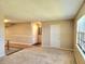 Spacious living room with carpeting, neutral walls, and natural light at 500 Newell Hill Rd # D, Leesburg, FL 34748