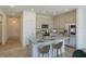 Well-lit kitchen featuring stainless steel appliances, granite countertops, and a convenient center island at 5027 Abigail Dr, Lake Wales, FL 33859