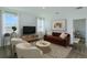 Cozy living room with neutral tones, modern furniture, large windows, and stylish decor at 5027 Abigail Dr, Lake Wales, FL 33859