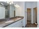 Bathroom with double sink vanity, quartz countertops, and a tiled shower at 5031 Abigail Dr, Lake Wales, FL 33859