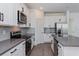 Well-appointed kitchen with an island, stainless steel appliances, and gray tile backsplash at 5031 Abigail Dr, Lake Wales, FL 33859