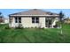 Lovely backyard featuring lush green grass and an inviting outdoor patio area at 5039 Abigail Dr, Lake Wales, FL 33859