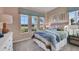 This bright bedroom boasts large windows, blue accents, and stylish furnishings for a comfortable and serene living space at 5039 Abigail Dr, Lake Wales, FL 33859