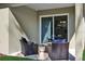 Cozy covered patio with comfortable seating, perfect for relaxing or entertaining guests at 5039 Abigail Dr, Lake Wales, FL 33859