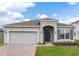 Charming one-story home with a brick paver driveway, well manicured lawn and blue shutters at 5043 Abigail Dr, Lake Wales, FL 33859