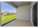 Outdoor living space on the covered lanai with a view of the backyard and greenery at 5043 Abigail Dr, Lake Wales, FL 33859