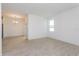 Spacious living room featuring ceramic tiling, ample sunlight and a modern chandelier at 5043 Abigail Dr, Lake Wales, FL 33859