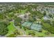 Aerial view of a community with access to a golf course, swimming pool, and tennis courts at 511 Chula Vista Ave, The Villages, FL 32159