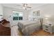 Cozy bedroom with a large window overlooking the landscaped backyard at 511 Chula Vista Ave, The Villages, FL 32159