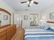 Bright bedroom with ample closet space and neutral color palette at 511 Chula Vista Ave, The Villages, FL 32159