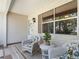 Inviting front porch with rocking chairs, a small table, and charming decor at 511 Chula Vista Ave, The Villages, FL 32159