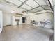 Large garage with epoxy floors, custom storage, bike racks, and overhead lighting at 511 Chula Vista Ave, The Villages, FL 32159