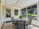 Covered patio with screened windows and view of backyard at 511 Chula Vista Ave, The Villages, FL 32159