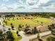 Aerial view shows expansive baseball and softball fields in a well-maintained community at 5325 Zisa Ct, The Villages, FL 32163