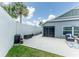 Private backyard including seating area, lawn, and mature landscaping at 5325 Zisa Ct, The Villages, FL 32163