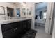 Bright bathroom features a dual sink vanity with marble countertop and opens to the main bedroom at 5325 Zisa Ct, The Villages, FL 32163