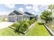 Charming single-story home with a well-manicured lawn and inviting curb appeal at 5325 Zisa Ct, The Villages, FL 32163