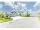 Spacious driveway and a beautifully landscaped yard of this charming home at 5325 Zisa Ct, The Villages, FL 32163