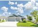 Well-manicured home with beautiful front yard landscaping at 5325 Zisa Ct, The Villages, FL 32163