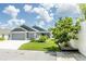 Gorgeous home with a neatly manicured lawn and stylish exterior lighting at 5325 Zisa Ct, The Villages, FL 32163