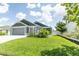 Well-maintained home with beautiful landscaping, healthy green grass, and a welcoming front yard at 5325 Zisa Ct, The Villages, FL 32163