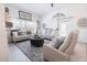 Inviting living room with neutral decor, plush seating, and natural light at 5325 Zisa Ct, The Villages, FL 32163
