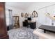 Stylish office features a desk, hardwood-look flooring, accent rug, and contemporary decor at 5325 Zisa Ct, The Villages, FL 32163