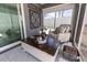 Enclosed sunroom with stylish accents and natural light streaming in at 5325 Zisa Ct, The Villages, FL 32163