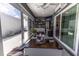 Cozy sunroom with modern furnishings, open to the outdoor area at 5325 Zisa Ct, The Villages, FL 32163