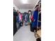 Spacious walk-in closet with ample shelving and storage space for shoes and clothing at 5325 Zisa Ct, The Villages, FL 32163