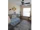 Charming bedroom with a daybed, a bright window, and cozy decor creating a relaxing atmosphere at 5373 Compass Pt # 1, Oxford, FL 34484