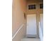 Inviting home entrance with staircase and decorative metal tree on wall at 5373 Compass Pt # 1, Oxford, FL 34484