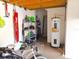 View inside of a garage showing the water heater, shelves, and storage at 5373 Compass Pt # 1, Oxford, FL 34484