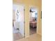 Hallway view revealing two bedrooms with inviting decor and a glimpse of comfortable living spaces at 5373 Compass Pt # 1, Oxford, FL 34484