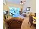 Bright living room featuring hardwood floors and comfortable furnishings, with outdoor views at 5373 Compass Pt # 1, Oxford, FL 34484