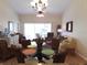 Charming living room featuring hardwood floors, ceiling fan, and comfortable seating at 5373 Compass Pt # 1, Oxford, FL 34484