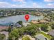 High-angle shot of a community home with lake views and easy access to nearby shopping and highways at 5530 Oxford Moor Blvd, Windermere, FL 34786