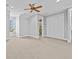This bedroom features neutral carpet, recessed lights, a ceiling fan, and access to a bathroom at 5530 Oxford Moor Blvd, Windermere, FL 34786