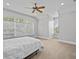 Spacious bedroom with large arched window offers plenty of natural light at 5530 Oxford Moor Blvd, Windermere, FL 34786