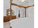 Spacious bedroom with neutral walls, carpet, wooden four poster bed and antique dresser at 5530 Oxford Moor Blvd, Windermere, FL 34786